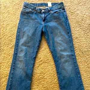 Lucky Jeans. Mid rise Flare Distressed cuffs.